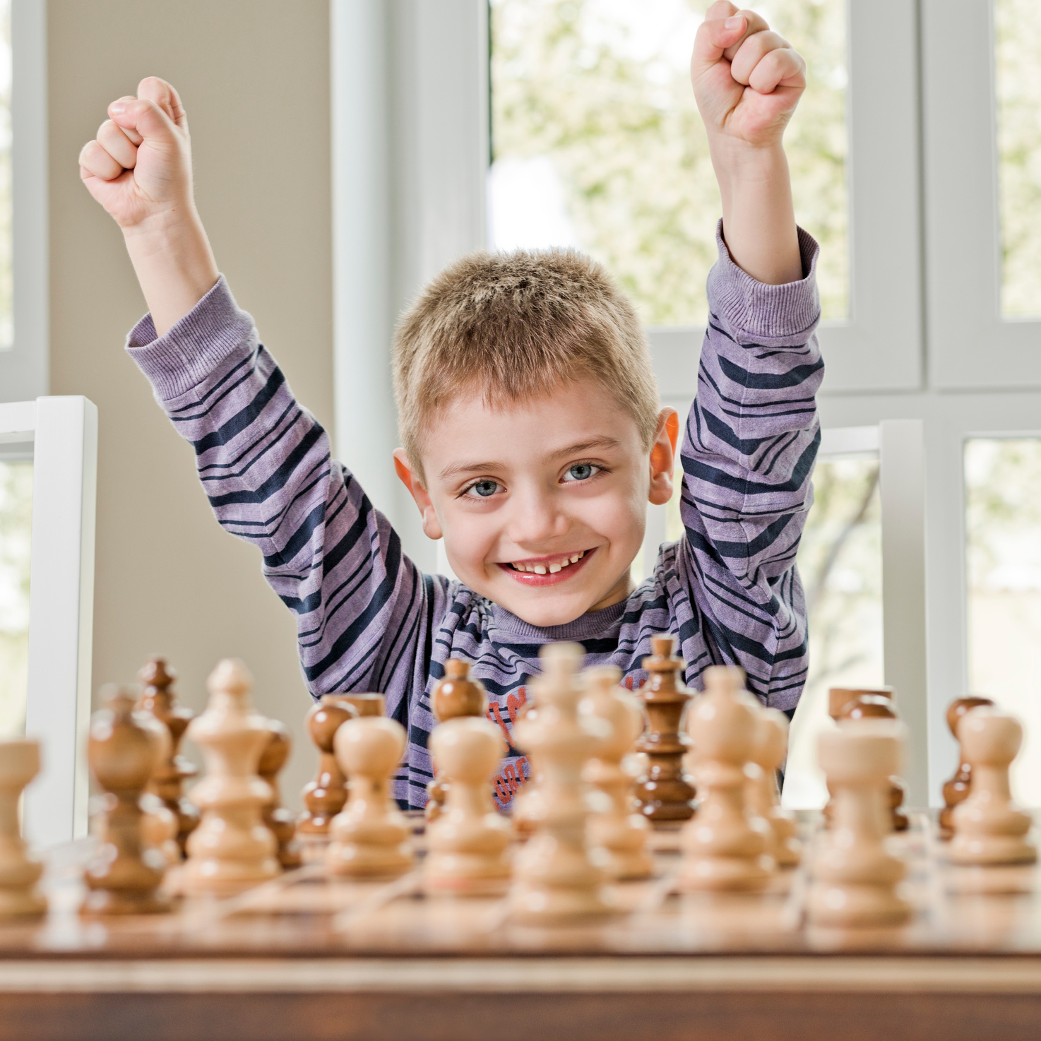 Boy playing chess and winning